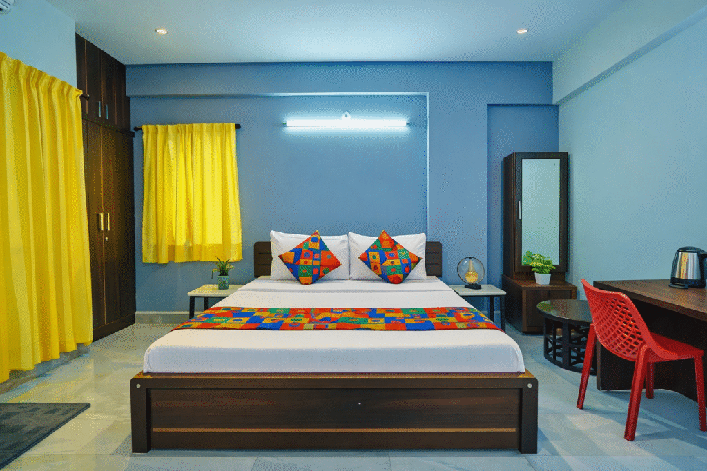 Budget hotel room in AECS Layout Brookefield with king bed, work desk, free Wi-Fi and bright interiors