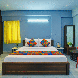 Budget hotel room in AECS Layout Brookefield with king bed, work desk, free Wi-Fi and bright interiors