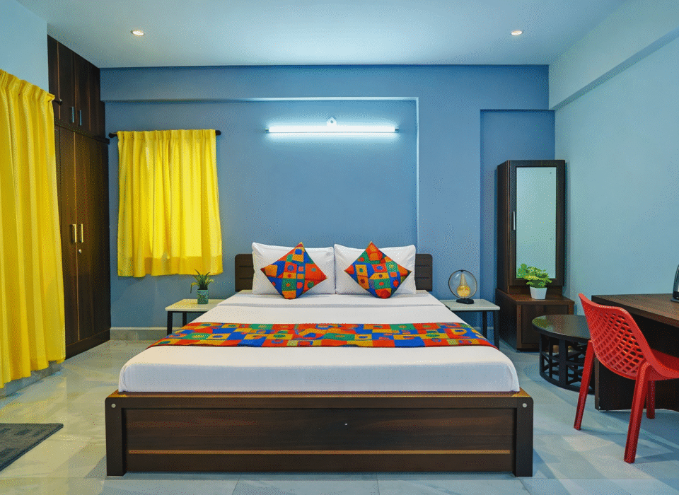 Budget hotel room in AECS Layout Brookefield with king bed, work desk, free Wi-Fi and bright interiors