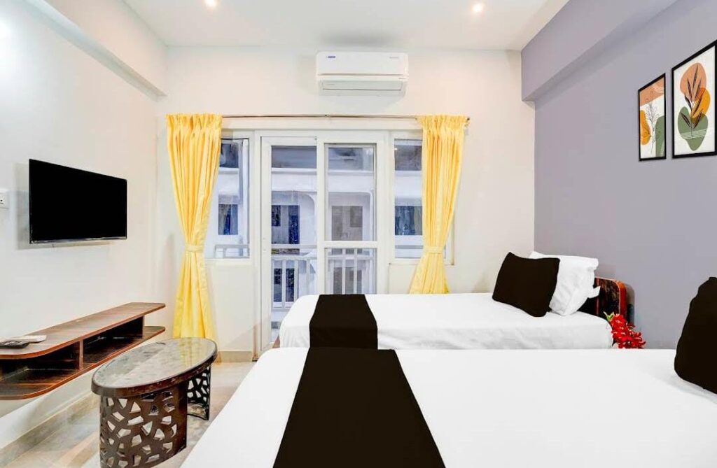 Hotel room with natural light and window at JG Residency AECS Layout